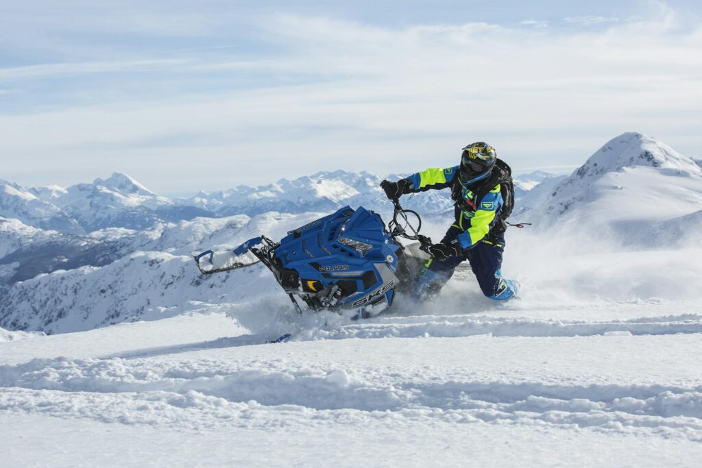 Man Riding Blue Snow Ski Scooter